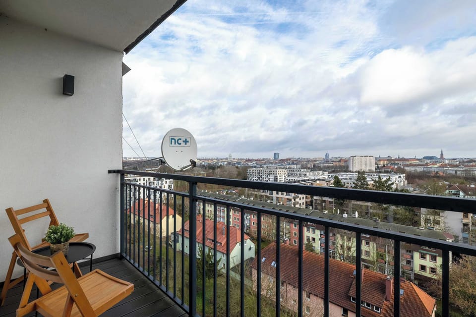 Furnished balcony with a beautiful city view.