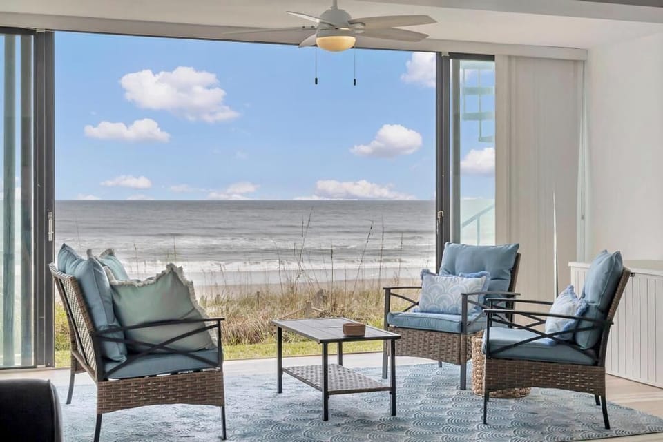 Sit back in comfy balcony seating & take in uninterrupted ocean views just beyond the dunes.