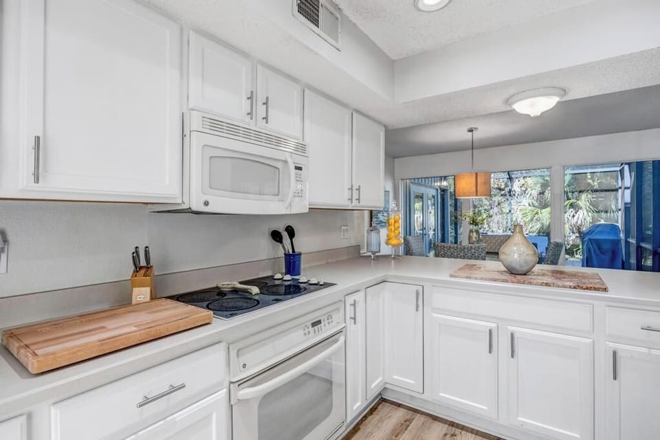 Contemporary kitchen layout designed for both cooking & gathering.