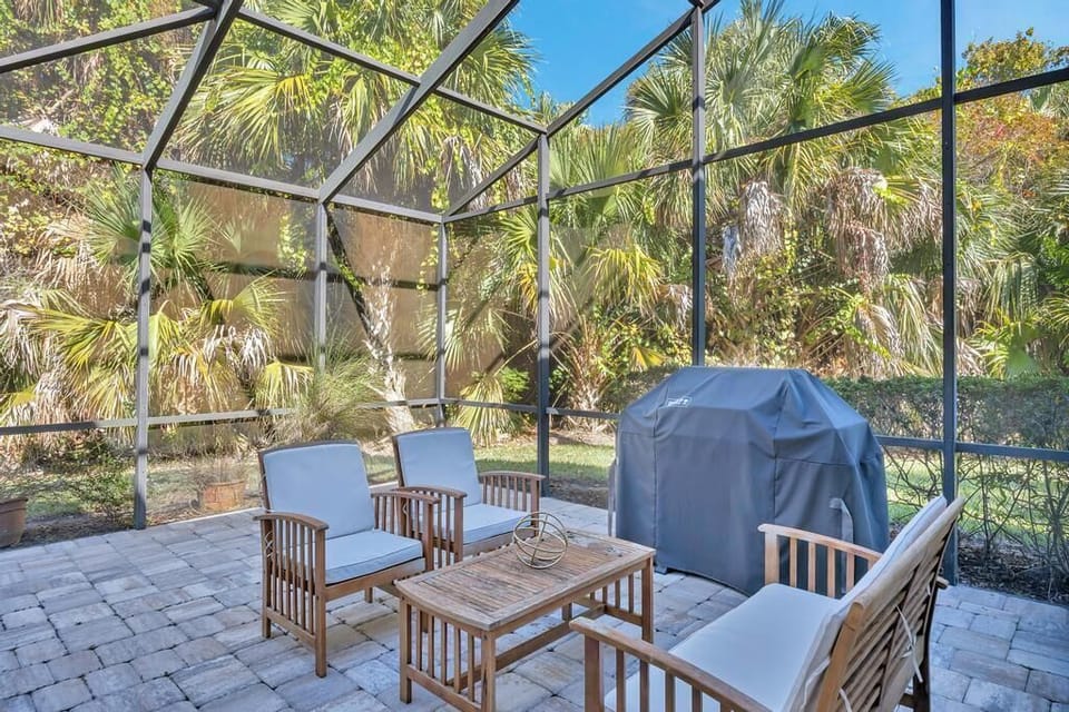 Shaded outdoor seating surrounded by trees, ideal for unwinding outdoors.