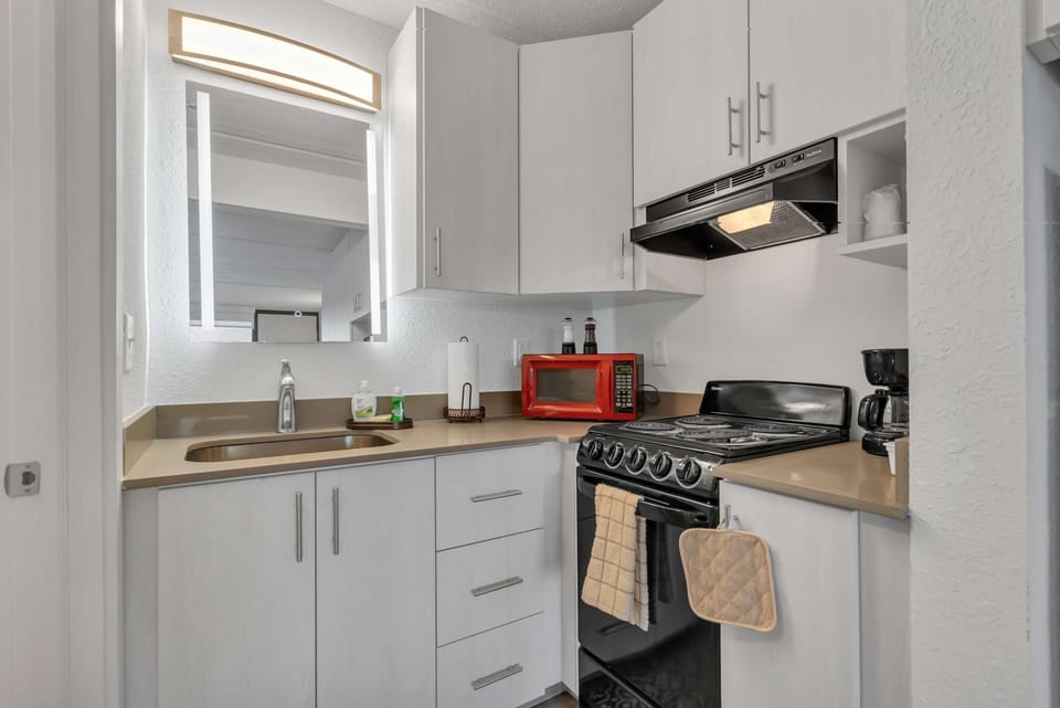 Blue paint (no panel) - Kitchen with red microwave and full cooking setup