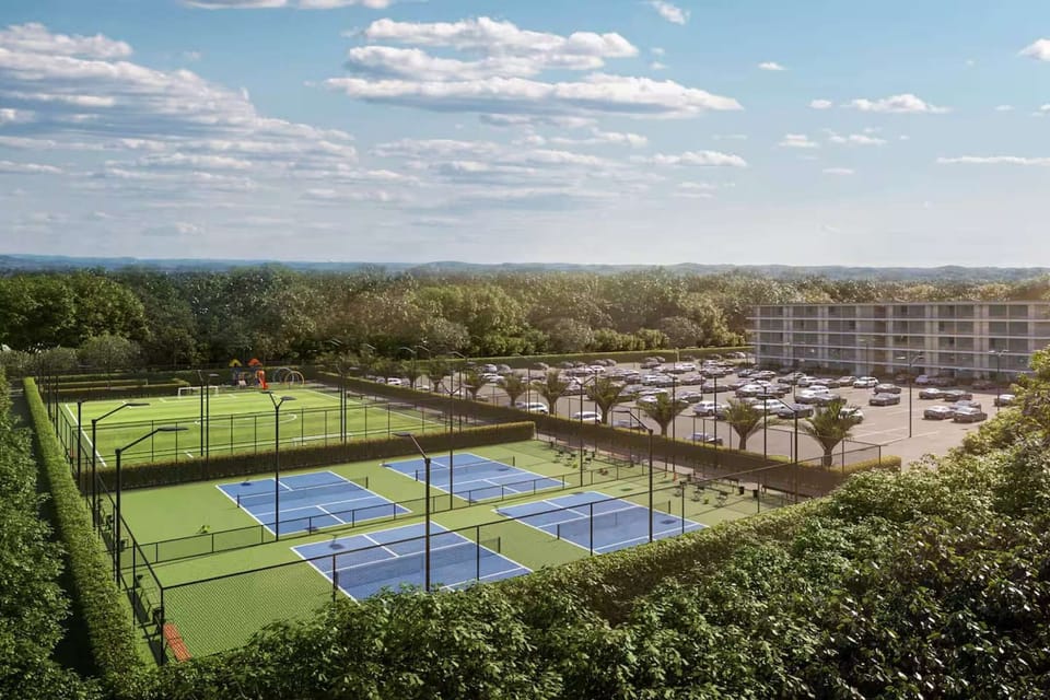 Tennis courts, soccer field, and parking