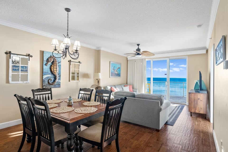 There is a dining table, perfect for enjoying a meal or playing a game, as well as additional breakfast bar seating.