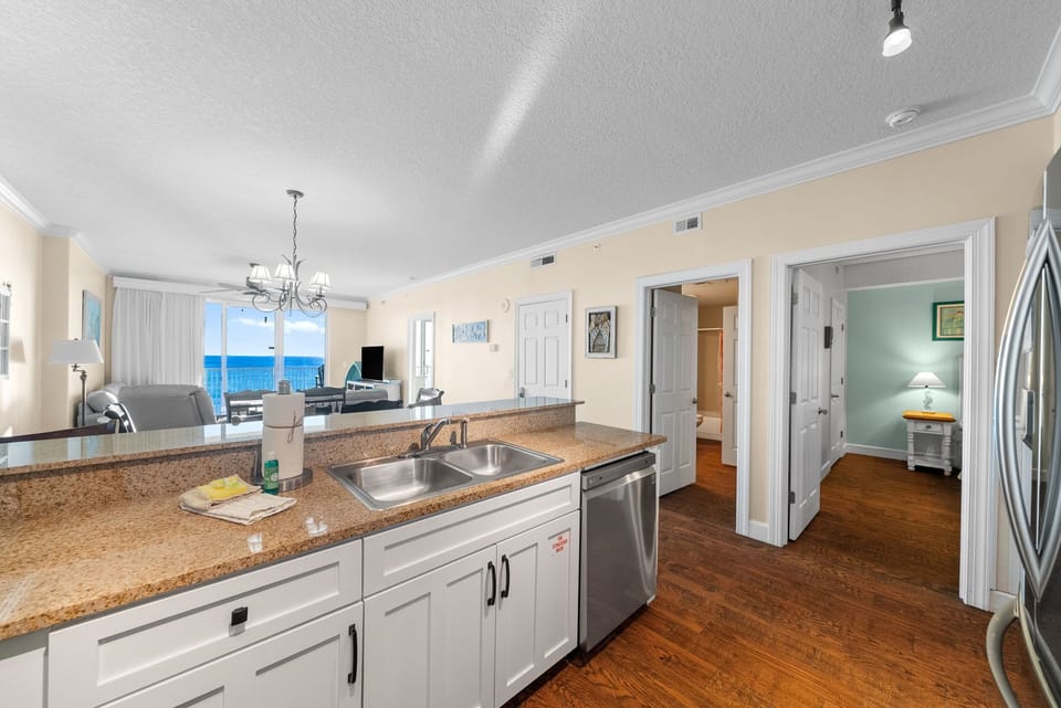 The fully equipped kitchen features granite countertops, mostly stainless-steel appliances, and has everything you need to prepare meals for family & friends.