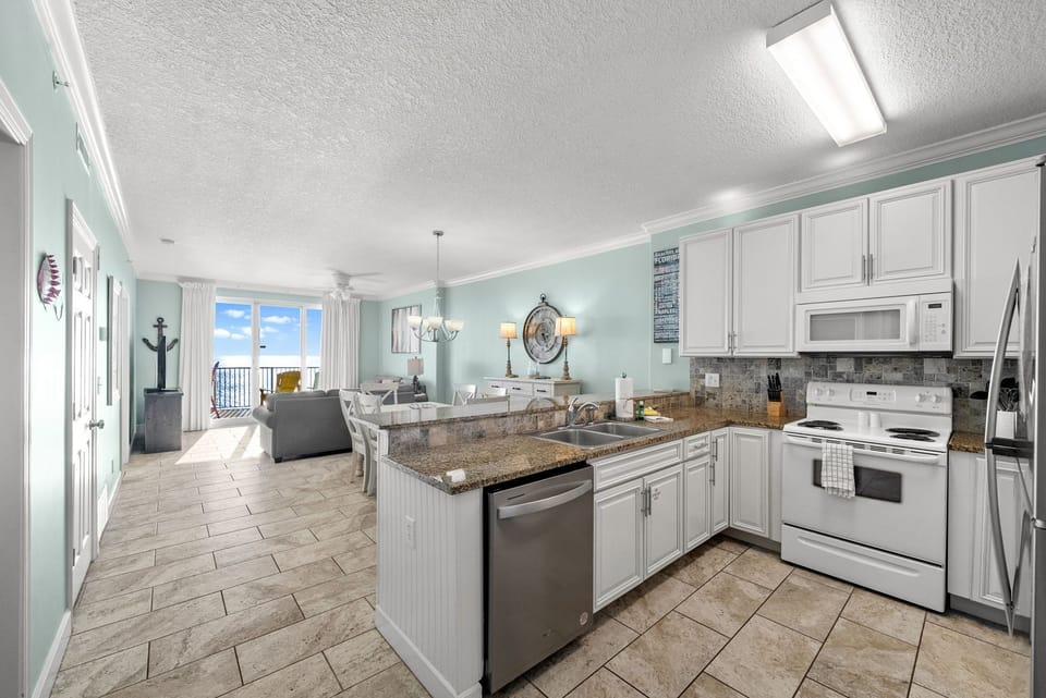 The fully equipped kitchen features granite countertops and has everything you need to prepare meals for family & friends.