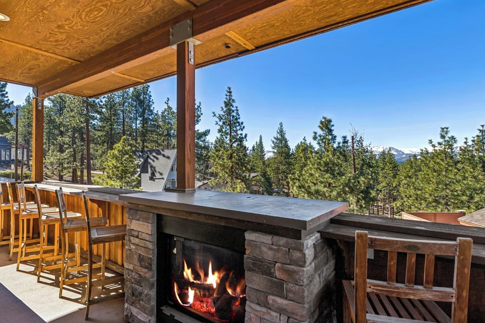 Gather around your private outdoor fireplace while soaking in stunning mountain views from this elevated terrace.
