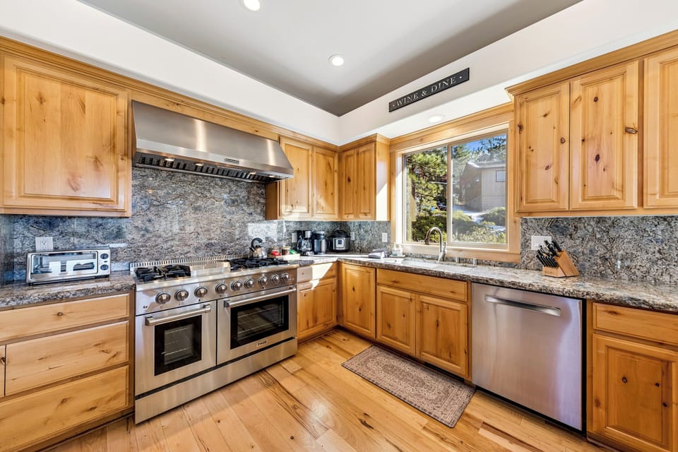 Gourmet kitchen outfitted with professional grade appliances large and small for effortless cooking