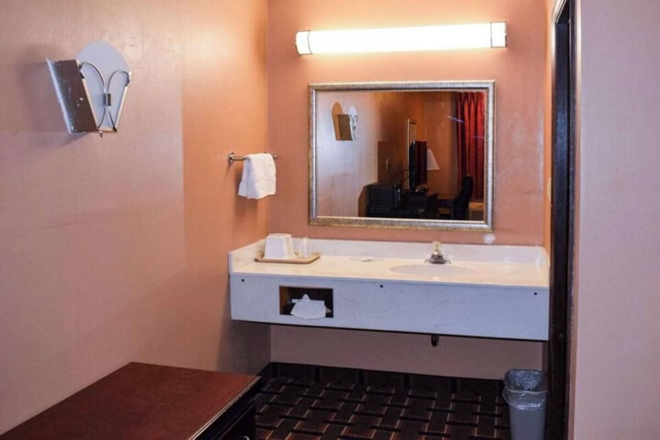 Get ready comfortably at the wide vanity under flattering lights.