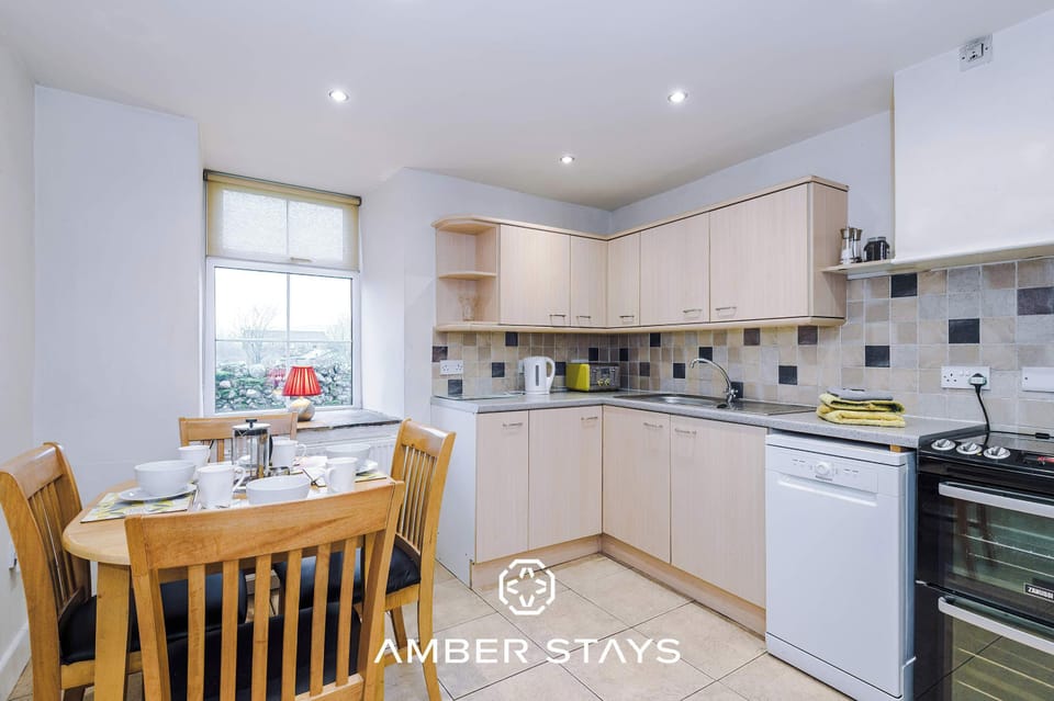 A fully equipped kitchen with modern appliances, ample counter space, and smart storage deal for cooking, entertaining, and enjoying meals.