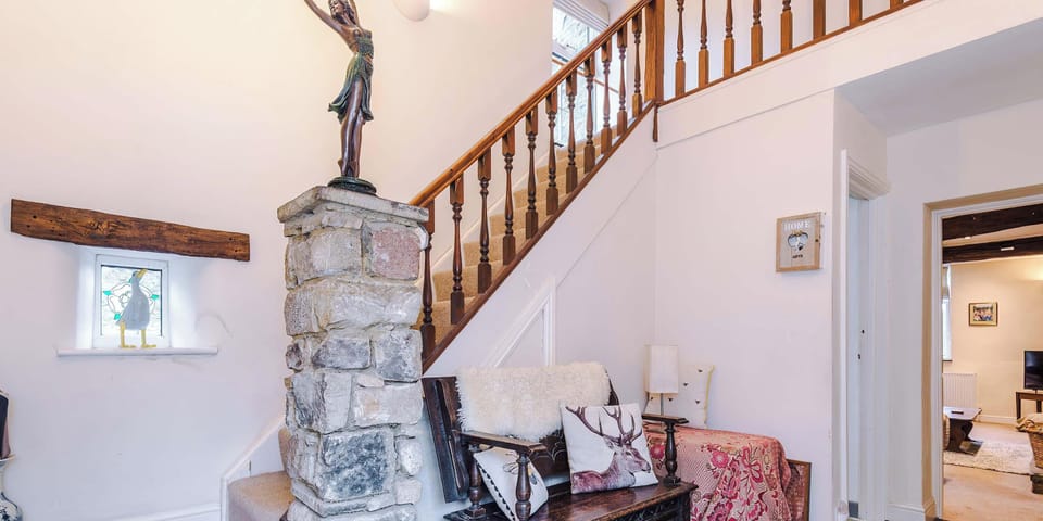 A bright and welcoming living room with comfortable seating, soft lighting, and a warm, inviting atmosphere perfect for relaxing or entertaining guests.