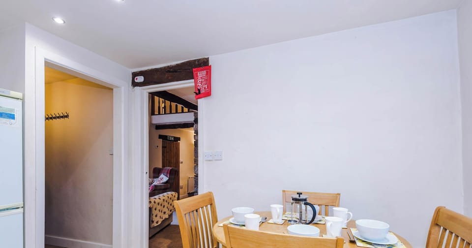 A stylish dining area with a spacious table, comfortable seating, and warm lighting—perfect for meals, conversation, and quality time together.”