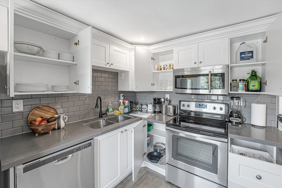 Dishes, blender, toaster, cutlery,  oil, salt and pepper, pots and pans, cleaning supplies, paper towel, cutting boards and much more!