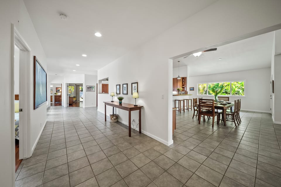Entry hallway opens into spacious living areas with an inviting island vibe.