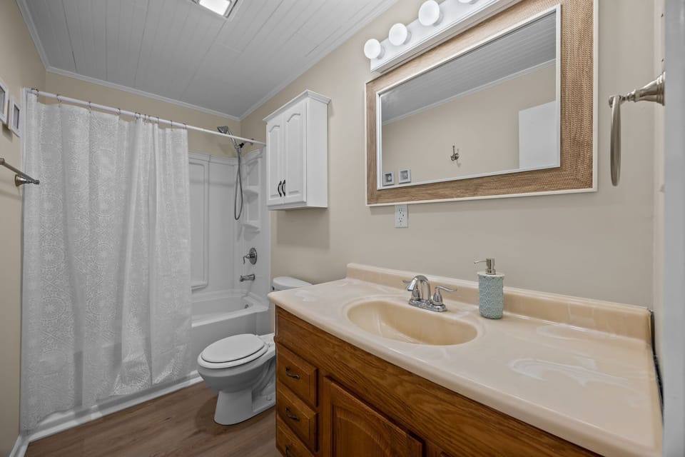 Main Level: Convenient Full Bathroom