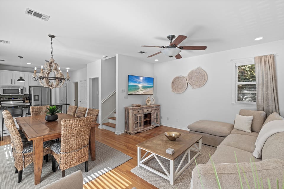 Relax in your bright, open living space where coastal charm meets modern comfort with elegant furnishings and abundant natural light.