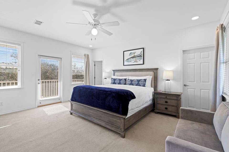 Sink into your comfortable king bed as gentle breezes from the ceiling fan create the perfect sleeping temperature in this serene retreat.