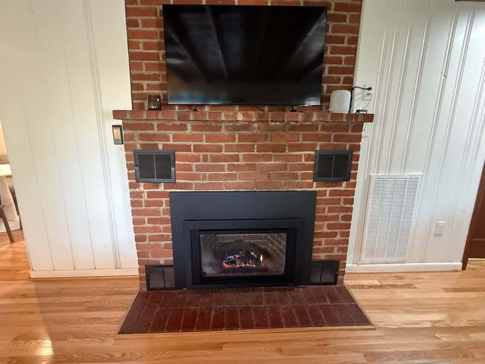 New insert installed March 2026, so fireplace is operational 