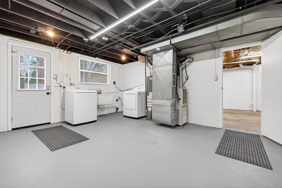 n-unit laundry area with washer and dryer for added convenience.