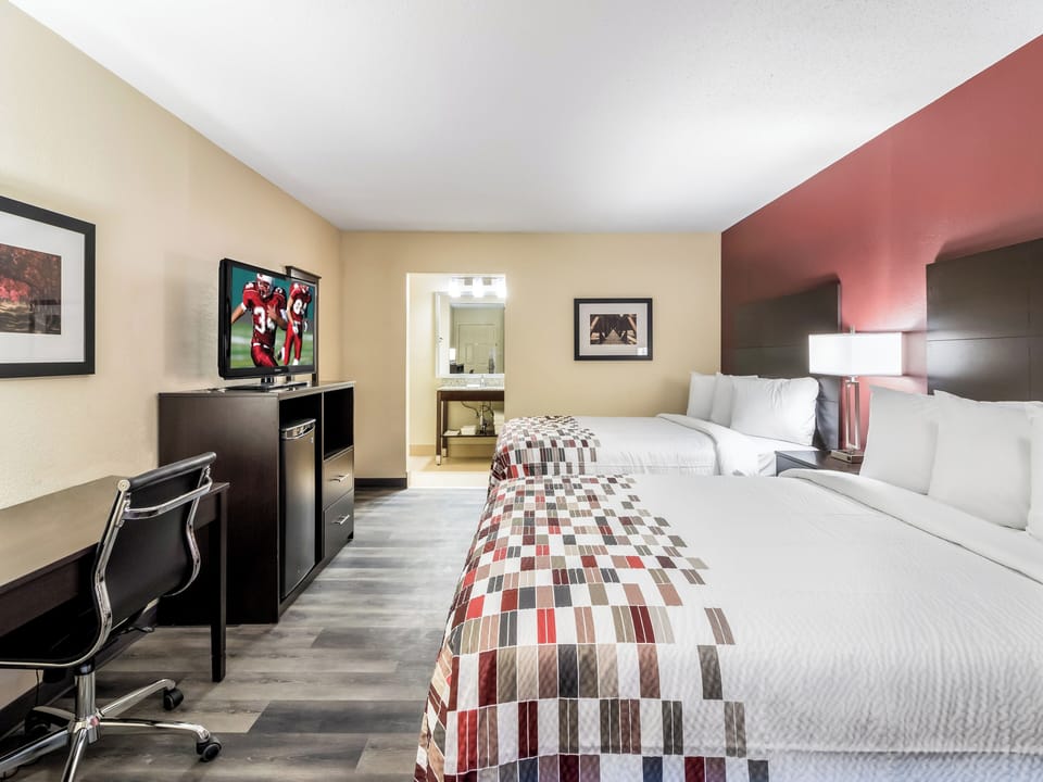Kick back in a spacious room with TV and work desk.
