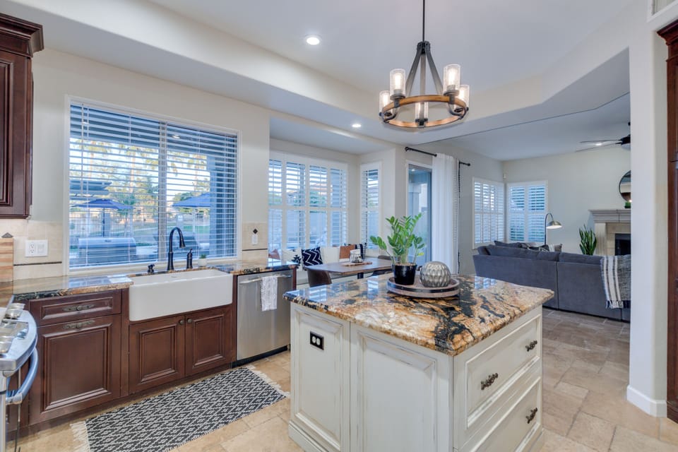Kitchen with windows facing patio and pool