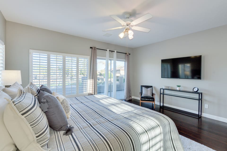 Primary bedroom with one king bed and slider to private patio