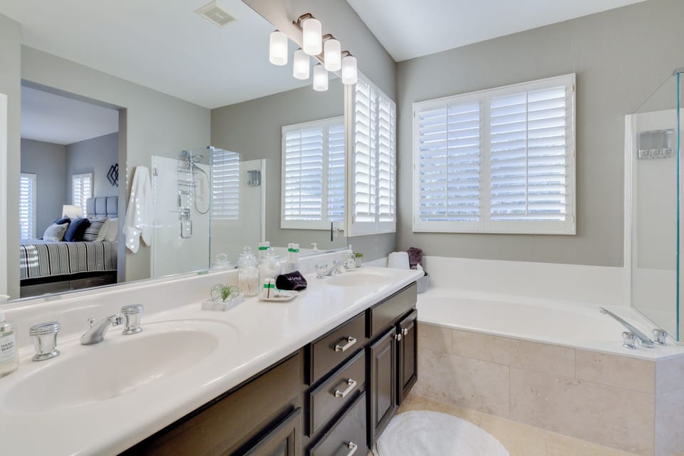 Primary en-suite bathroom with oversized tub and walk in shower