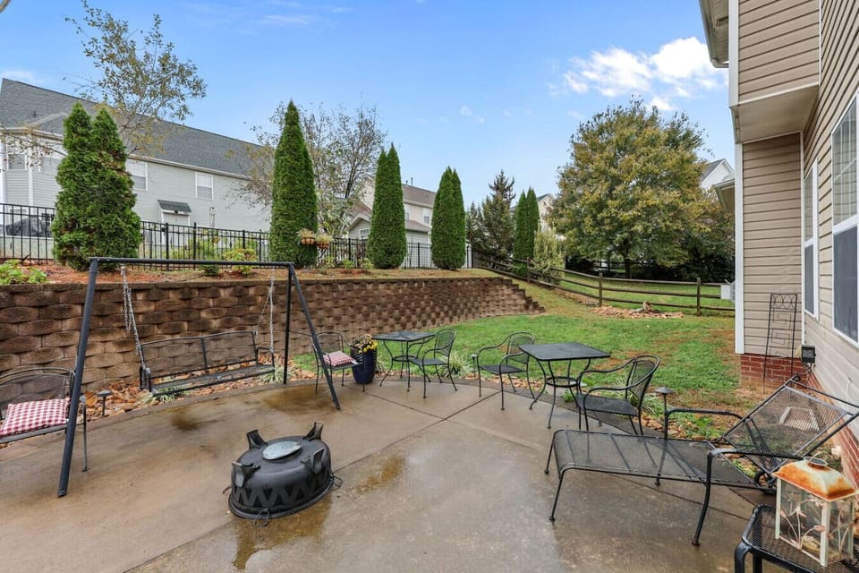 Wood-burning firepit and gas grill in private fenced backyard