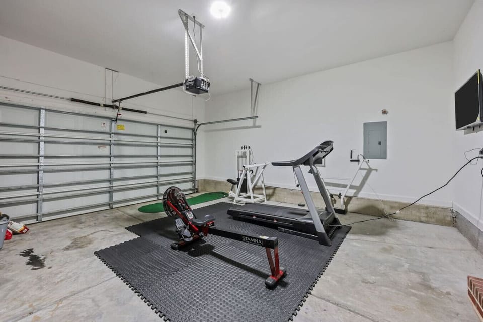 Private garage gym with exercise equipment — no need to skip workout day