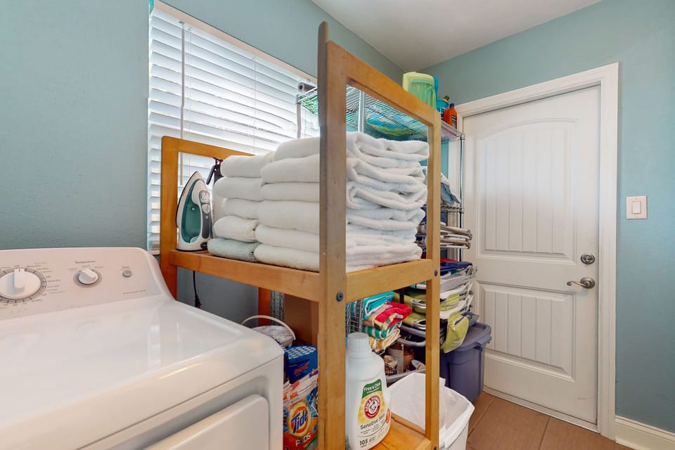 Keep your beach stay fresh and easy with this on-site laundry area. Stocked with towels and essentials, it's perfect for washing beachwear and staying comfortable throughout your seaside getaway.
