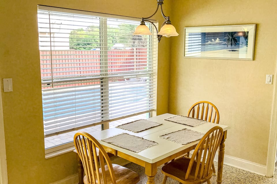 Enjoy meals in this cozy, sun-filled dining nook, perfect for a relaxing beach stay. Natural light and coastal décor create a welcoming spot to start your day or unwind after time at the beach.
