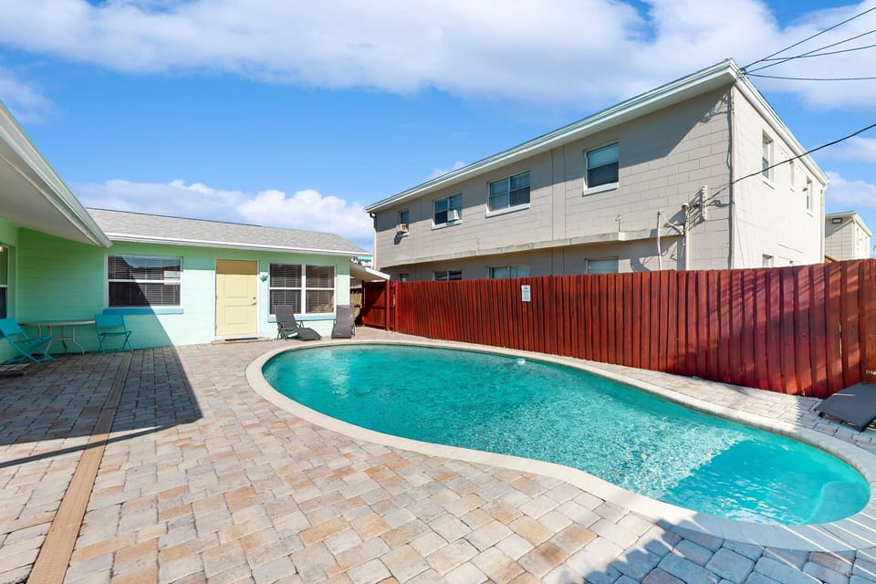 Enjoy your beach stay with a refreshing private pool and sunny patio. Perfect for relaxing after the beach, this outdoor space offers a peaceful spot to lounge, swim, and soak up the coastal vibes.