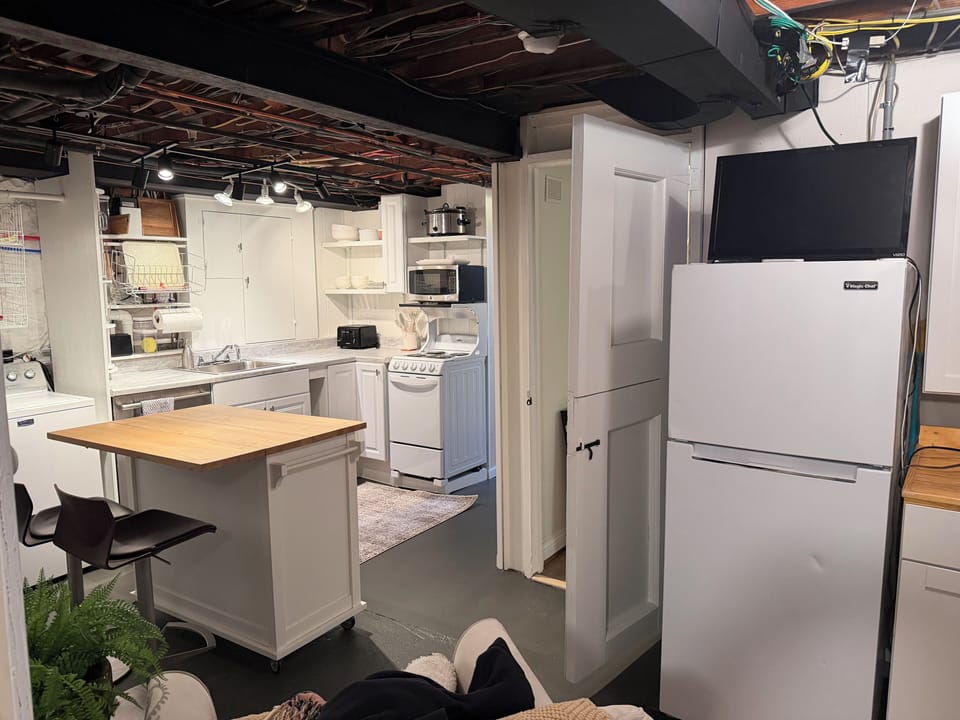 2nd lower level apartment style kitchen with washer dryer.