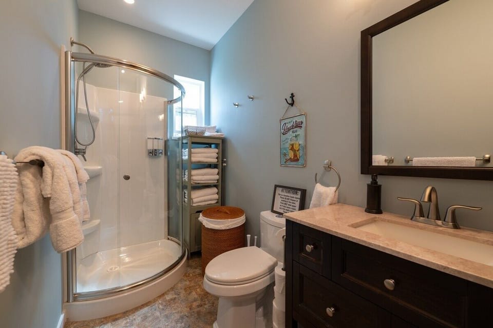 Main-floor bath with walk-in shower + shampoo/conditioner/body wash