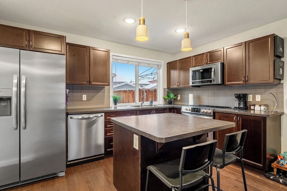 Full kitchen with a drip coffee machine, blender, rice cooker, ground coffee, tea, sugar and basic condiments (shampoo, conditioner, & body wash.)