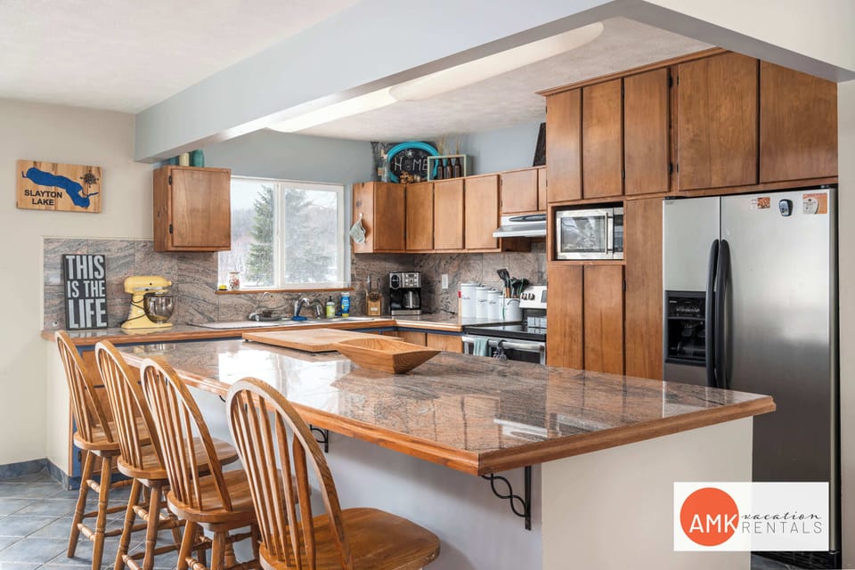 Upstairs eat in kitchen with modern appliances