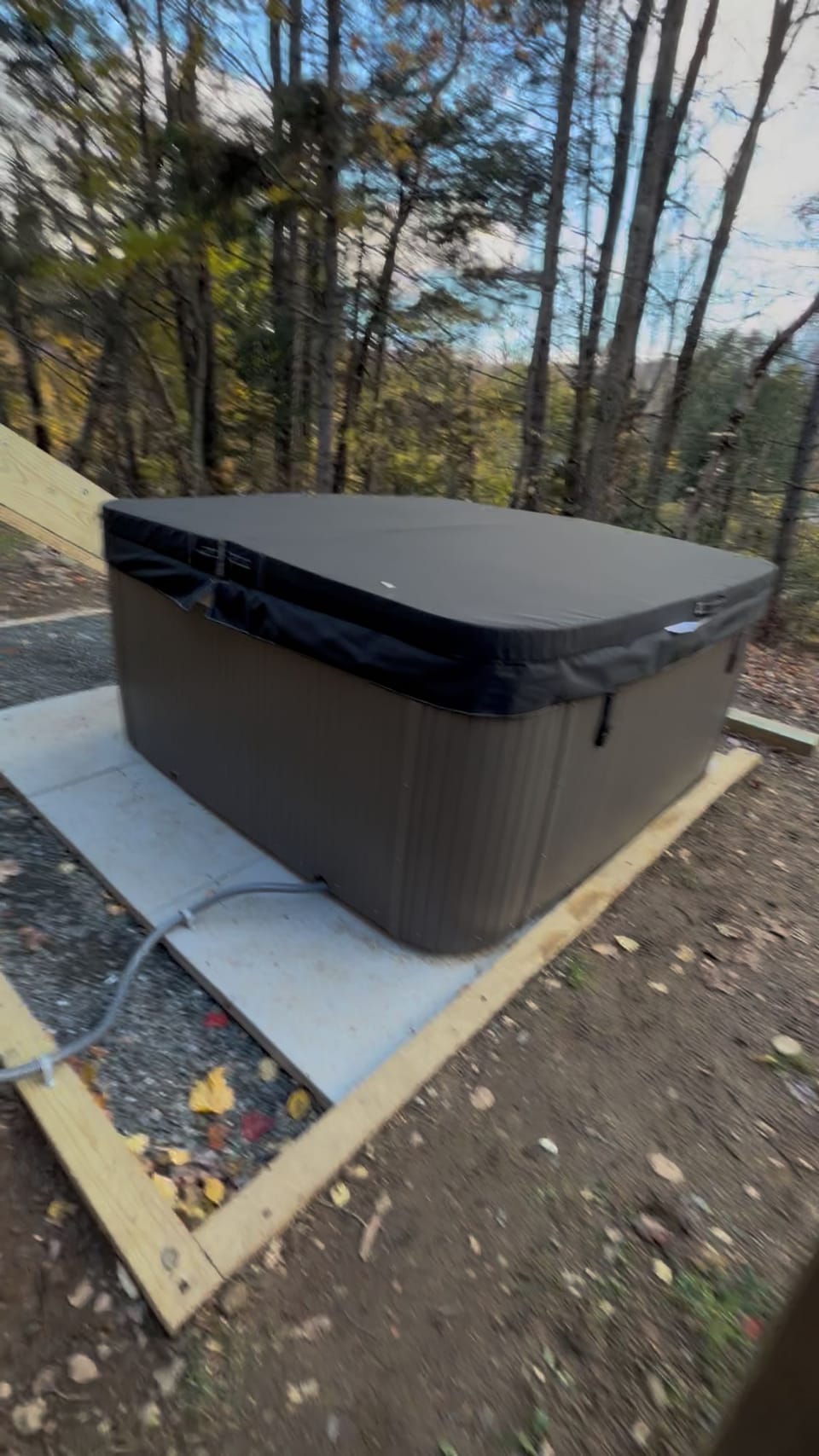 Private outdoor hot tub with peaceful wooded and mountain views