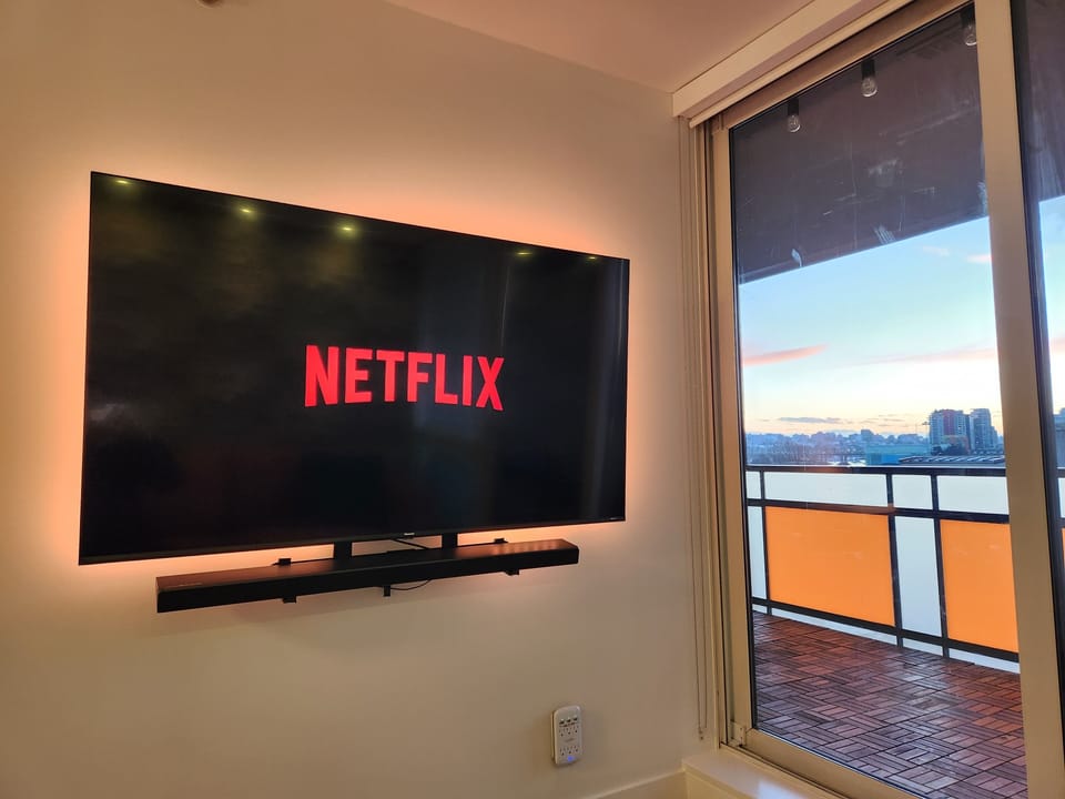Large TV with premium Samsung soundbar. Bonus: Color LED lights behind TV! 