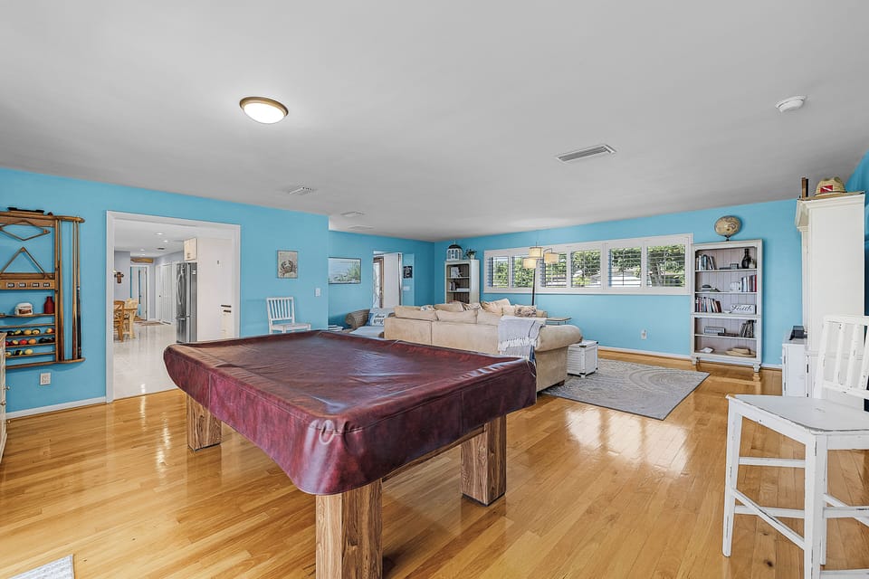 Game room with pool table and seating