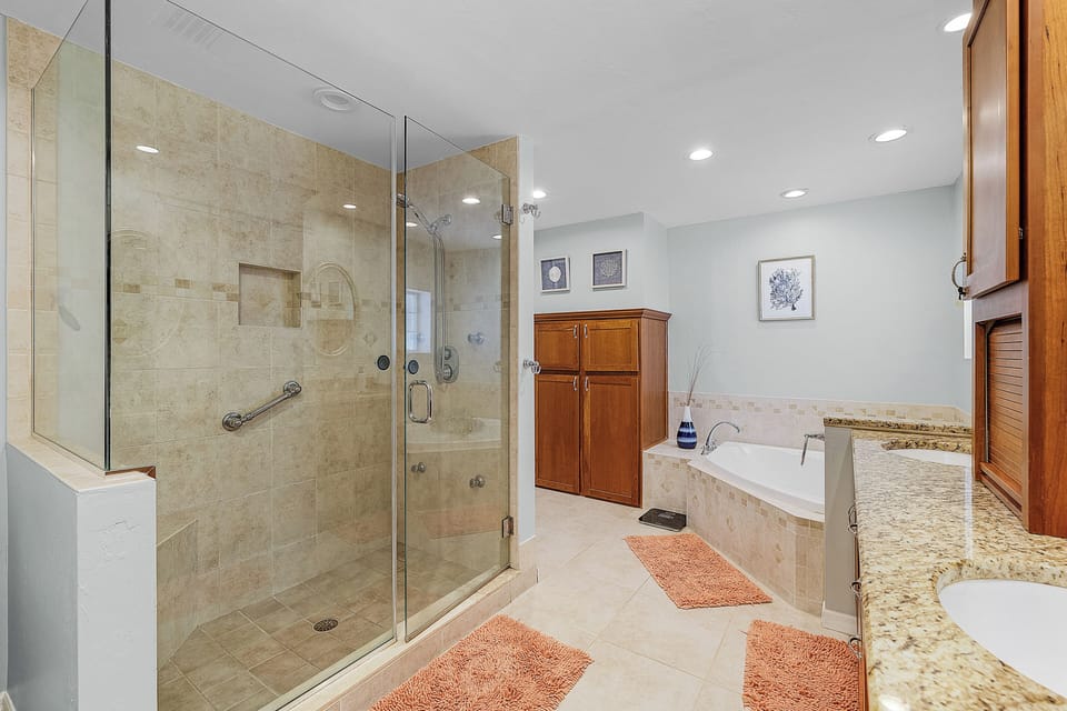 Primary bathroom with walk-in glass shower
