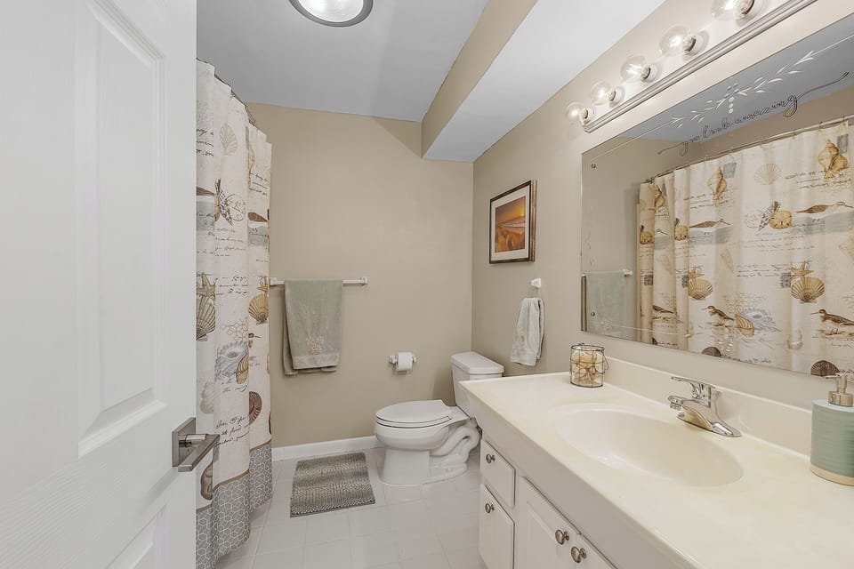 Shared bathroom with tub/shower combo