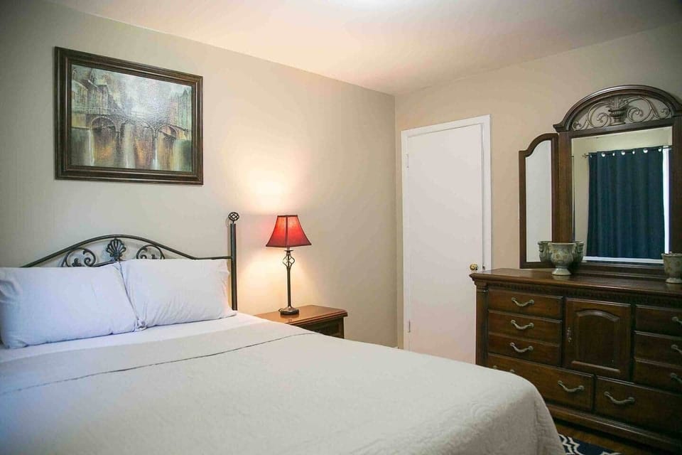 Master bedroom showing bed and large dresser