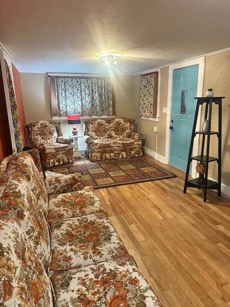 Living room with vintage floral couch set