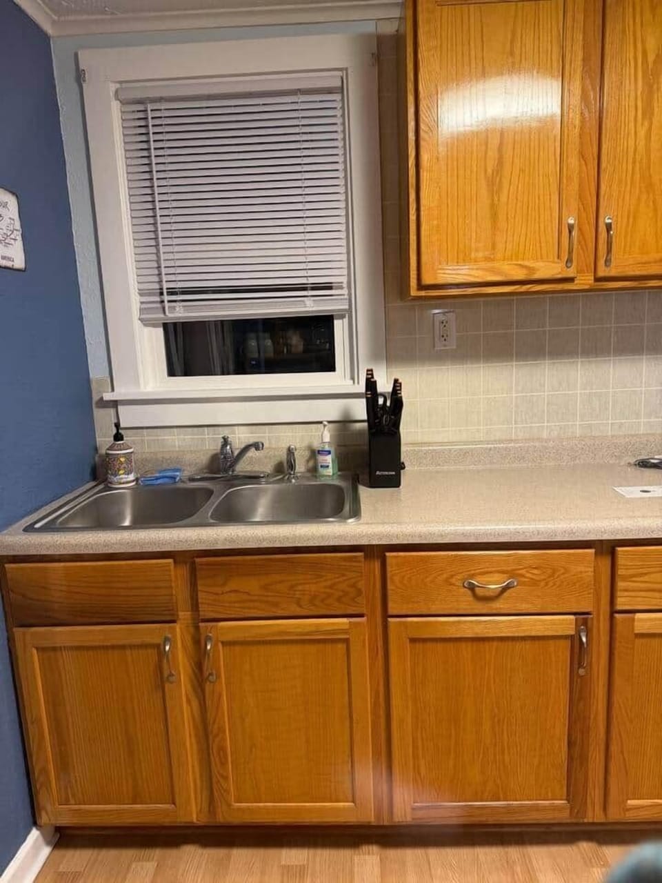 Kitchen sink and cabinets with dishware