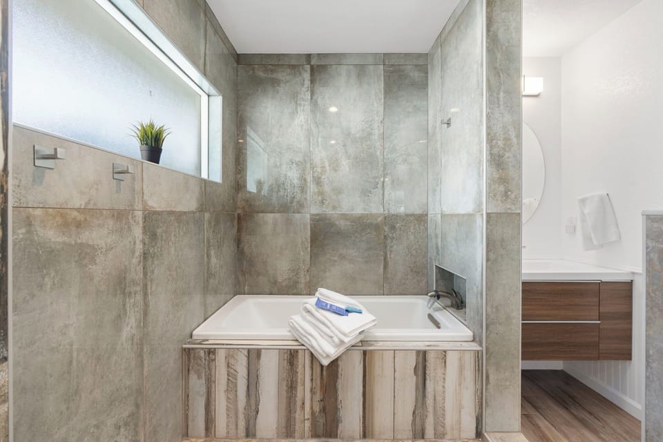Soaking tub separate from showers.