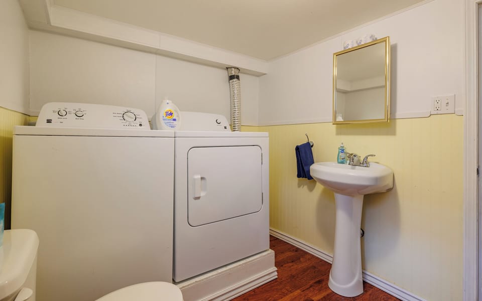 Lower level half-bath with convenient full size washer and dryer