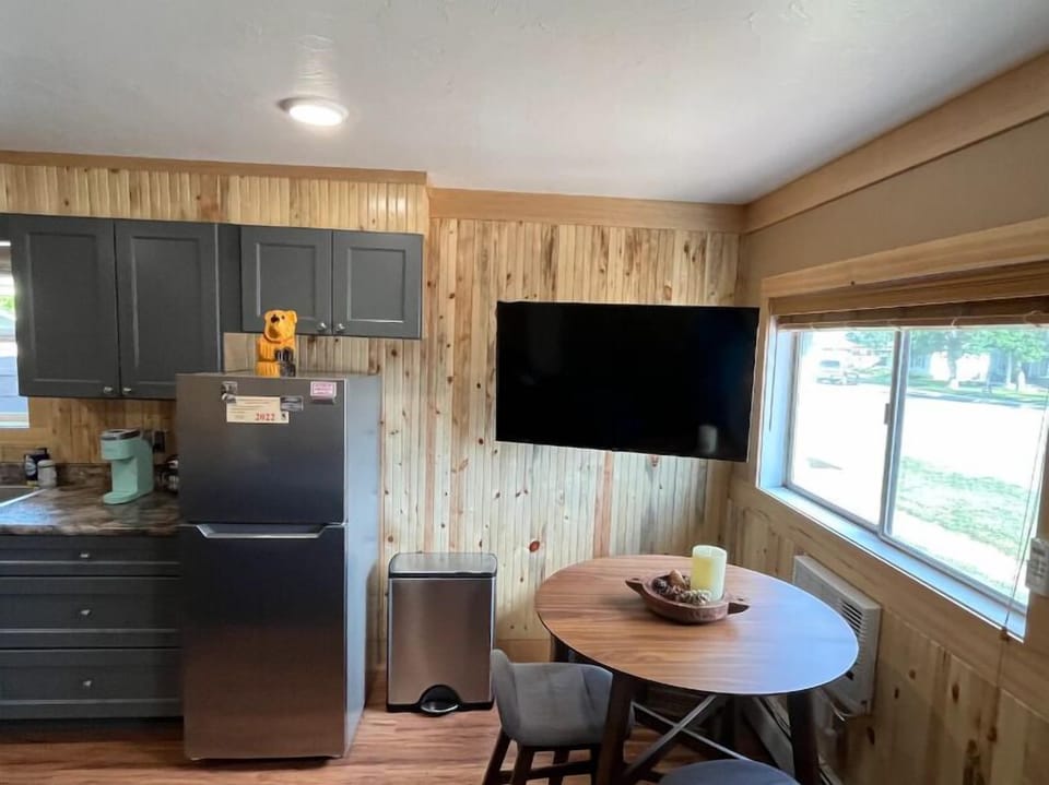This thoughtful space has a dining area and large smart tv for relaxing