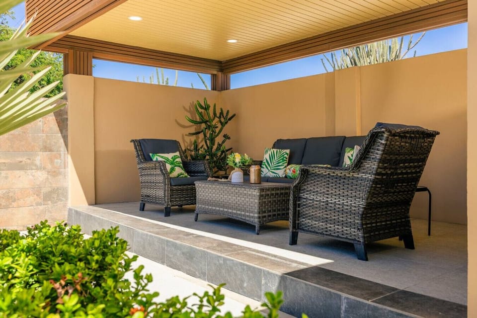 Relax and unwind in this cozy outdoor seating area, perfect for morning coffee or quiet evenings during your stay.