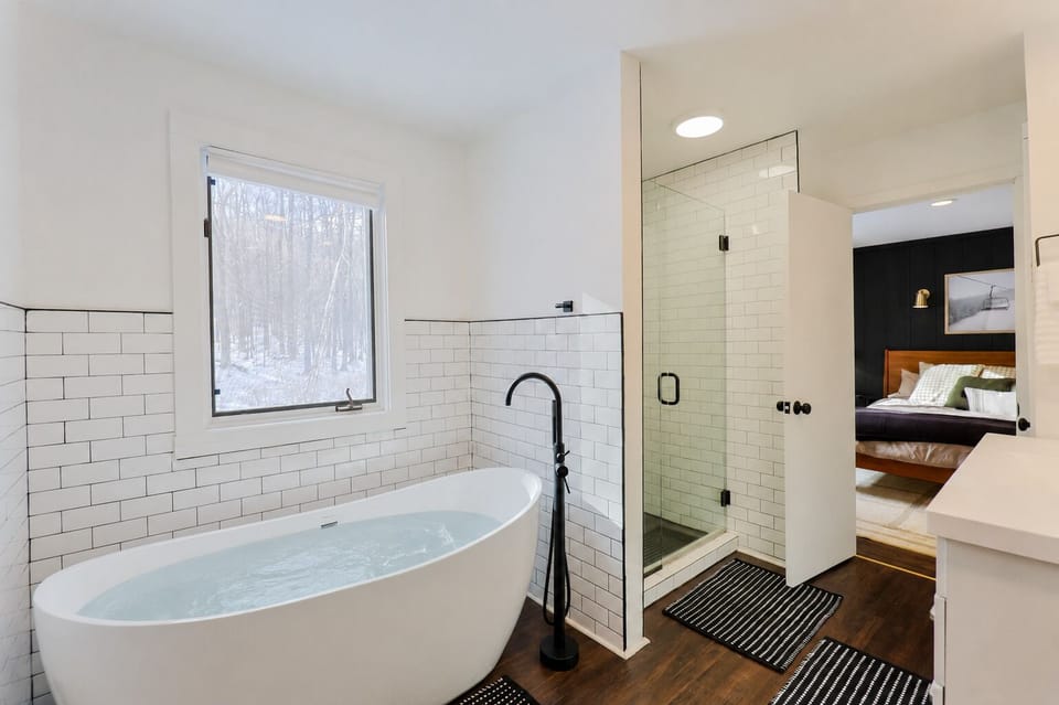 Jack & Jill Primary Bathroom • Free standing soaker tub • Modern glass shower