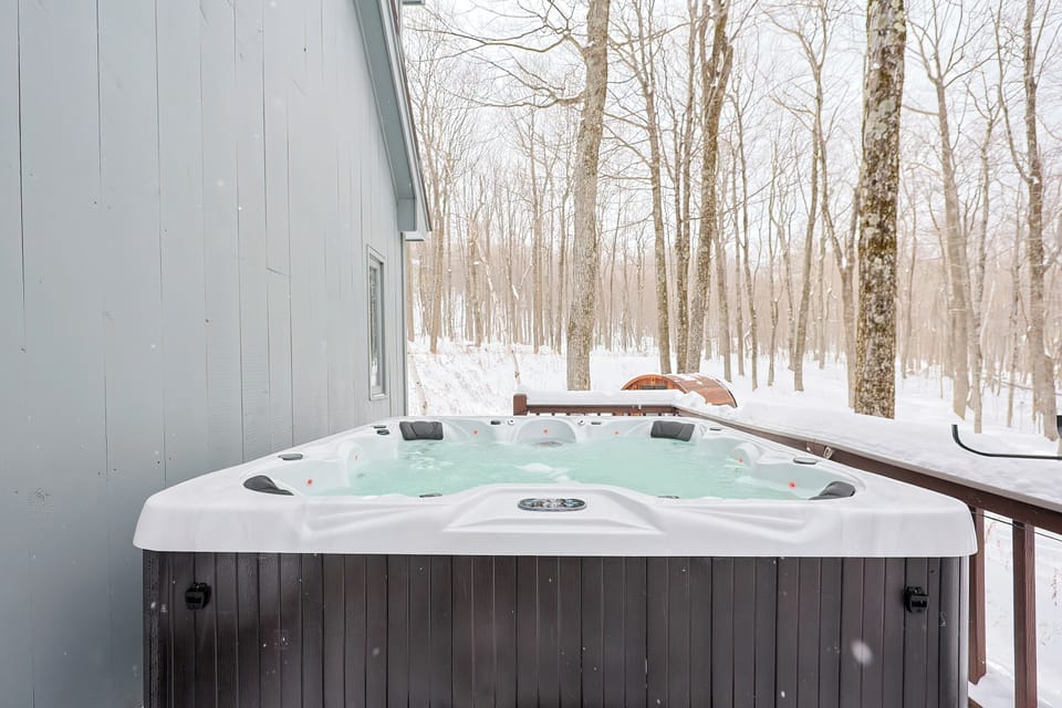 8 person hot tub • Private wooded lot • Sauna off deck