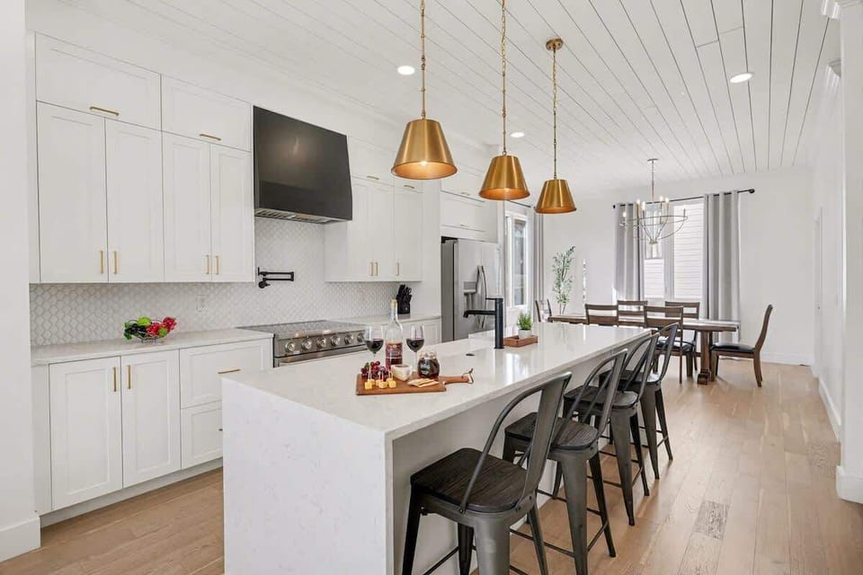 2nd Floor: Fully equipped kitchen with stainless steel appliances, a kitchen island with seating for 4 guests, wine cooler, and amble counter space.